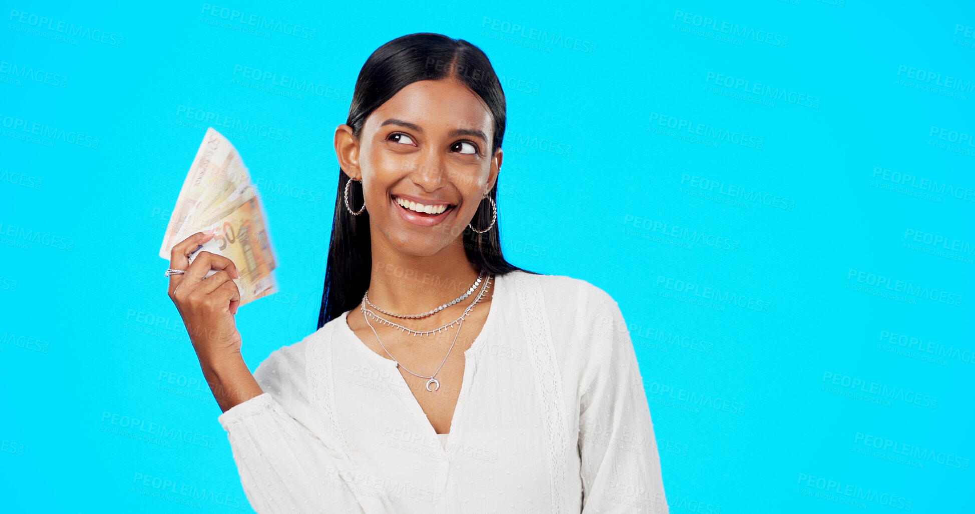 Buy stock photo Money, fan and happy woman in studio with savings, budget or financial investment of bonus salary. Smile, banking and girl with cash lottery prize, tax exchange or income profit on blue background.