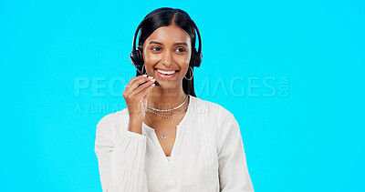 Buy stock photo Call center, communication and happy woman in studio for customer service, FAQ advisory and IT questions. Indian telemarketing agent, virtual consultant and contact with microphone on blue background