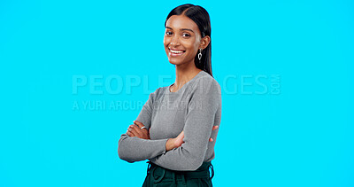 Buy stock photo Arms crossed, business and portrait of Indian woman in studio for career, job and work opportunity. Professional, confidence and face of happy person on blue background with pride, ambition and joy