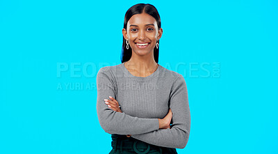 Buy stock photo Professional, crossed arms and portrait of Indian woman in studio happy for career, job and work opportunity. Business, confidence and face of person on blue background with pride, ambition and joy