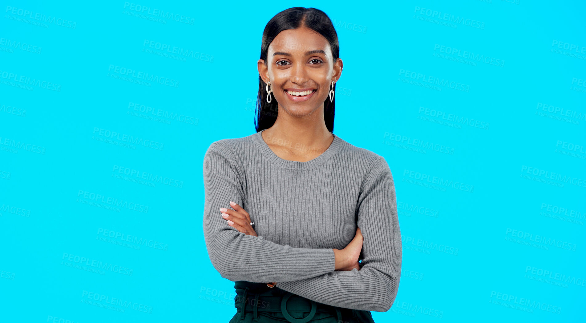 Buy stock photo Professional, crossed arms and portrait of Indian woman in studio happy for career, job and work opportunity. Business, confidence and face of person on blue background with pride, ambition and joy