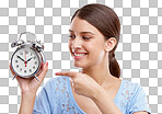 Clock, time and pointing with a model woman in studio isolated on a png background for alarm or reminder. Alarm clock, point and schedule with a young female on blank space for a deadline