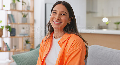 Face, happy and woman on couch, relax and positive in living room, carefree and resting. Portrait, American female and lady on sofa, smile and stress relief in lounge, girl with happiness or cheerful