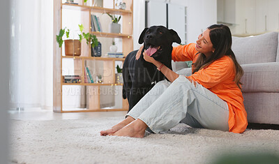 Woman, happiness and dog in a home with pet owner love, support and care feeling relax. Dogs scratch, young female and happy person sitting on a living room floor in a house with a smile and animal