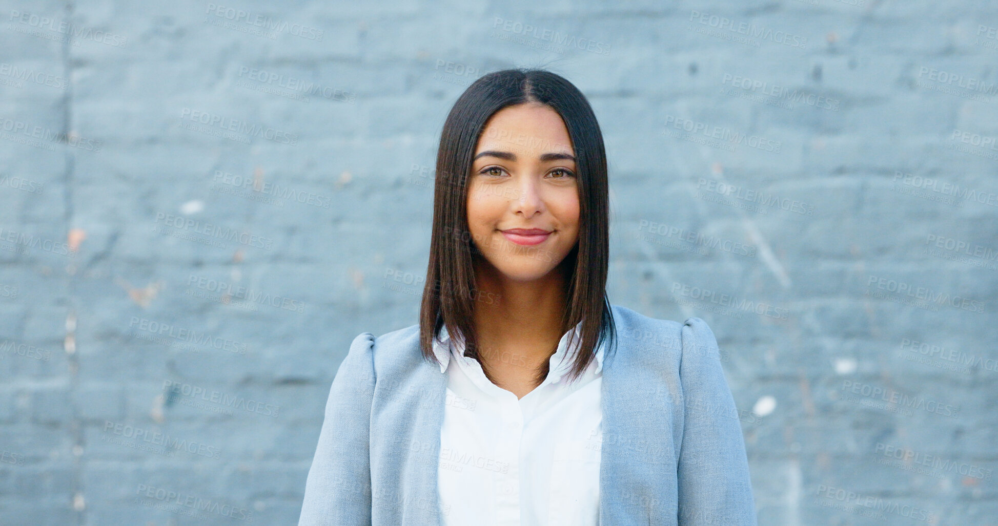 Buy stock photo Happy, wall and portrait of business woman with positive, good and confident attitude at office. Smile, legal career and face of professional female attorney from Mexico with pride by gray building.