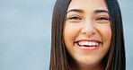 Closeup of laughing woman showing cheerful facial expression against grey wall background with copy space in city. Portrait, headshot or face of smiling, fun and trendy student giggling at funny joke