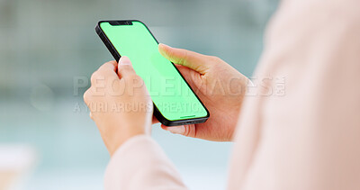 Hands using a phone showing green screen for copy space Woman browsing online and checking social media on a mobile device display with chromakey outside. Single female swiping on a dating app