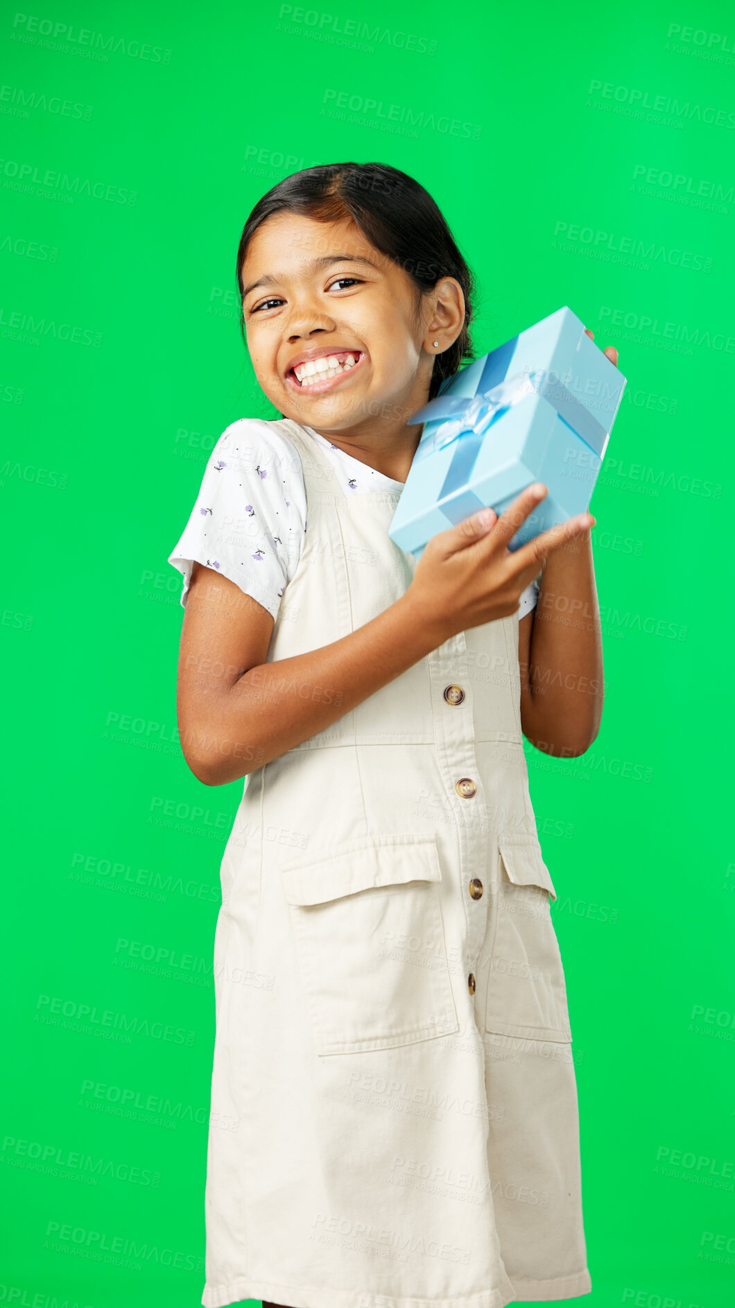 Buy stock photo Excited, gift and girl child on a green screen isolated on a studio background. Shaking, happy and portrait of a girl with excitement about a birthday, Christmas or holiday present on a backdrop