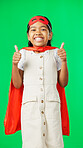 Little girl, superhero and thumbs up on green screen for success against a studio background. Portrait of happy adorable child or kid in hero cosplay showing thumb emoji, yes sign or like on mockup