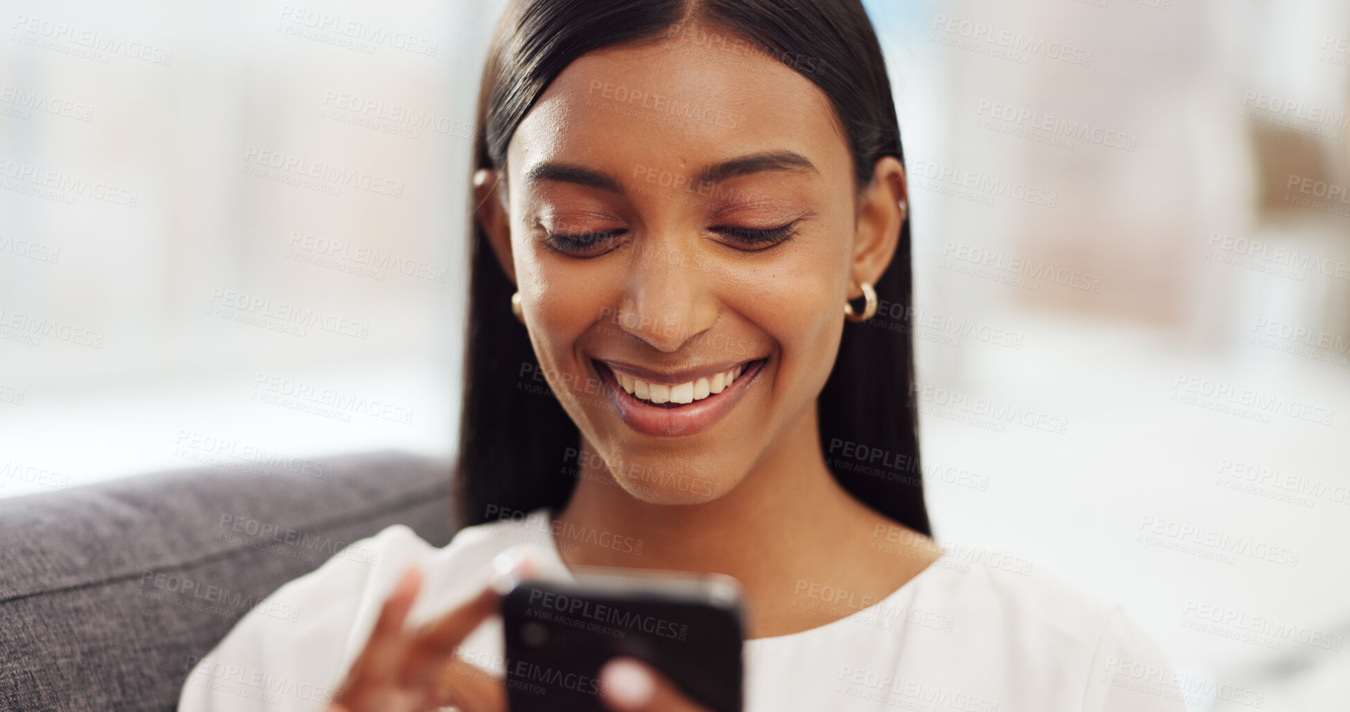 Buy stock photo Social media, happy and Indian woman on sofa with phone  for online website, internet and texting at home. Communication, connection and person relax in living room on smartphone for mobile app