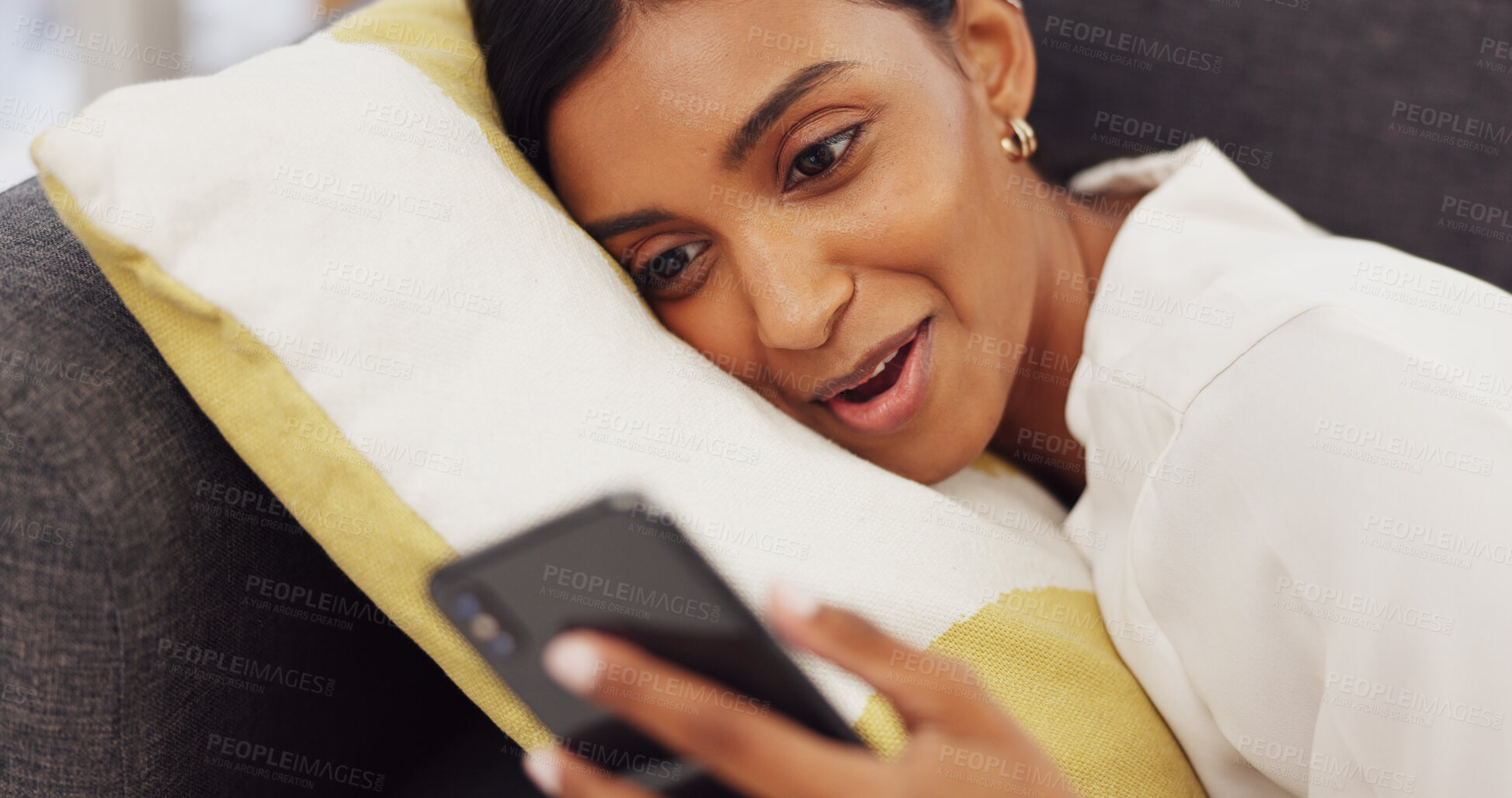 Buy stock photo Social media, phone and happy Indian woman on sofa for online website, internet and texting at home. Communication, connection and happy person relax in living room on smartphone for mobile app