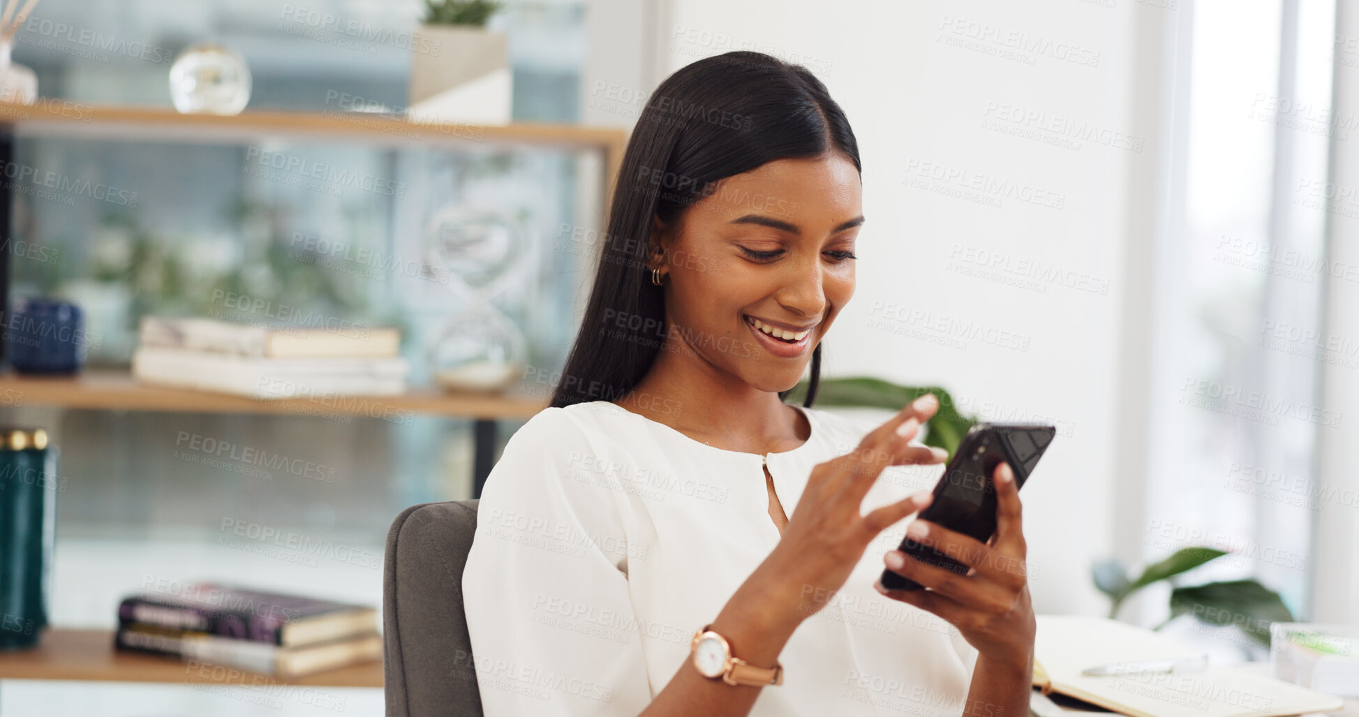 Buy stock photo Happy woman at desk with phone, scroll on social media or email, networking and connectivity on mobile app. Online communication, internet search or chat, girl with smile and cellphone reading meme.