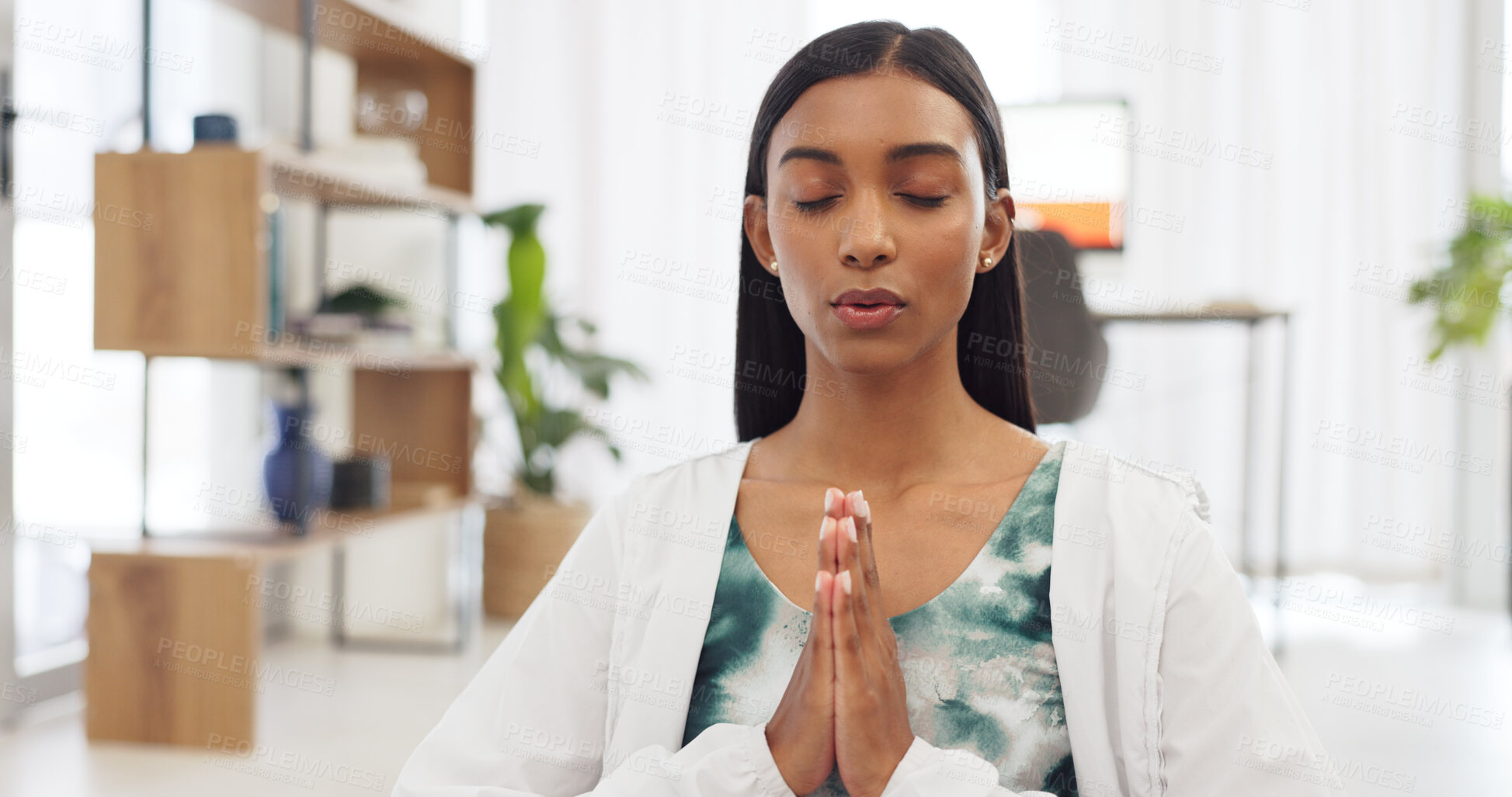 Buy stock photo Meditation, calm and Indian woman in house for praying, zen energy and mindfulness in living room. Mental health, hands together and person breathe for wellness training, relax and mediate in morning