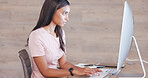 Female psychologist working on a schedule or online appointments and making notes in her calendar diary. One young professional therapist planning, checking and filing information on desktop computer