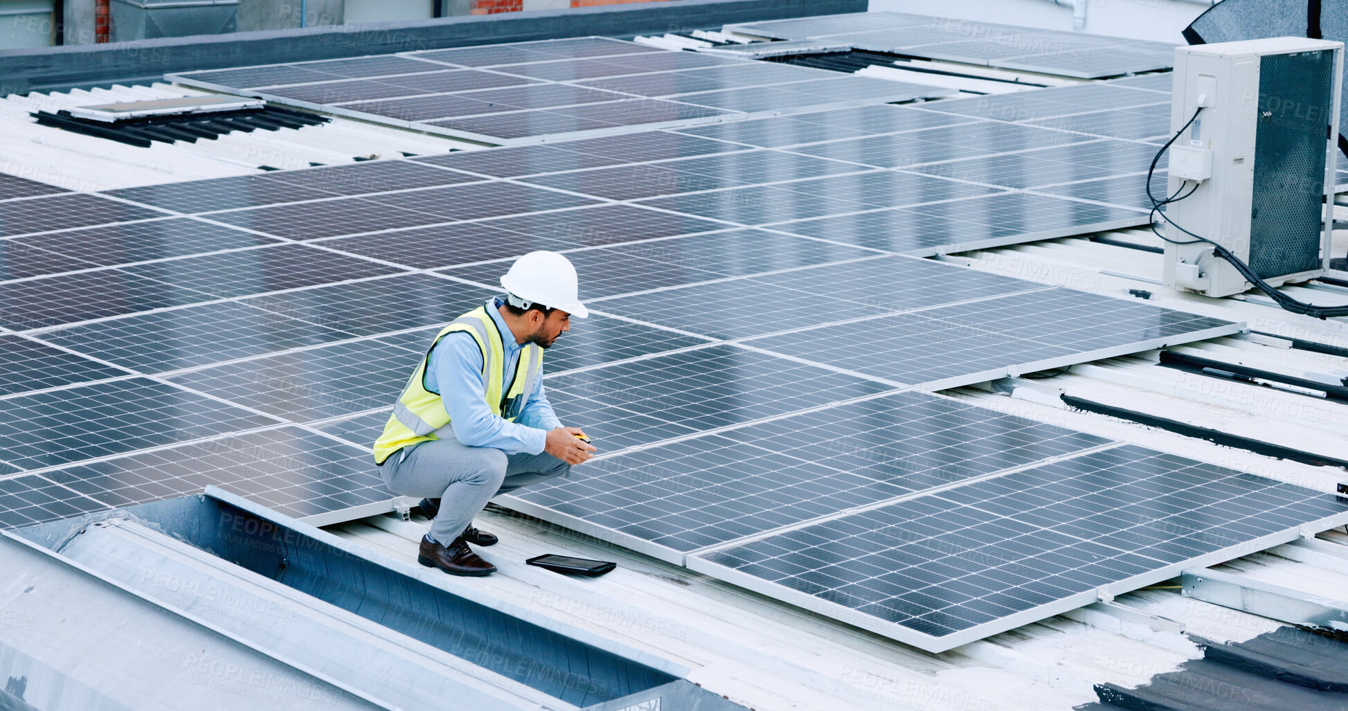 Buy stock photo Engineer, contractor and solar panel with a man on roof with sustainability project. Engineering technician, green clean energy and eco friendly work with monitoring and maintenance for electricity 