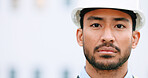 Face of a contractor and maintenance manager at a construction site with copy space. Portrait of an engineer with a hardhat overseeing a successful project development