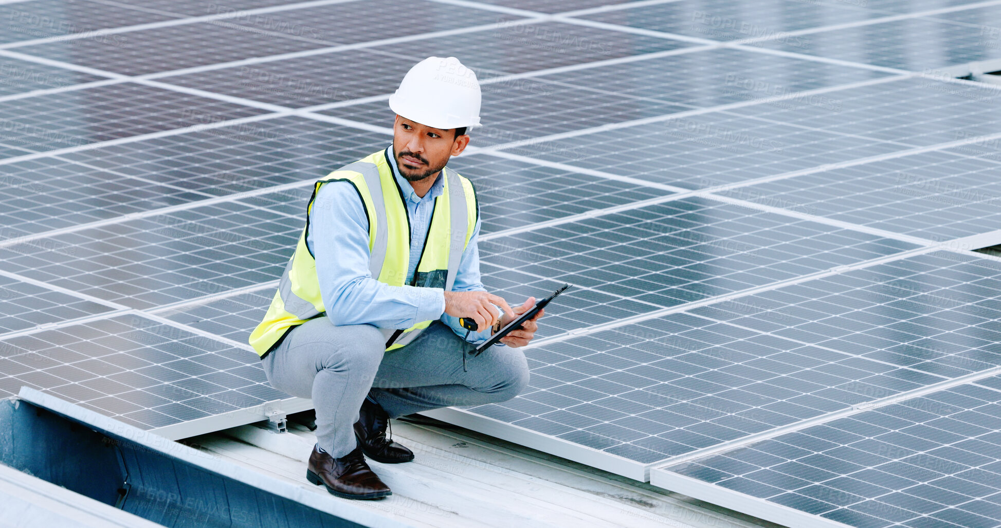 Buy stock photo Engineer, thinking and solar panel with a man and tablet on roof with sustainability project. Engineering technician, green clean energy and eco friendly work with monitoring and maintenance worker 