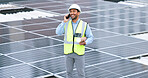 Ambitious, happy and confident solar power installer, engineer and electrician talking on a phone while discussing blueprint plans for construction, building and maintenance of renewable energy