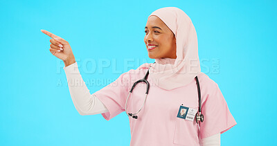 Buy stock photo Muslim nurse, happy or pointing to space on studio background for healthcare information, offer or medical deal. Doctor, professional or Islamic woman showing mockup, promotion and medicine choice