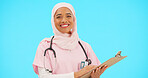 Woman, doctor and clipboard portrait in studio for information or medical records. Islamic or muslim female and professional nurse in hijab with smile and document for healthcare on blue background