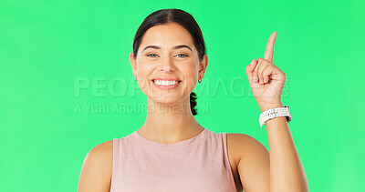 Buy stock photo Green screen portrait, happy woman and pointing up at advertising announcement, promotion notification, or branding. Face, service info or person presentation, choice or deal on studio background