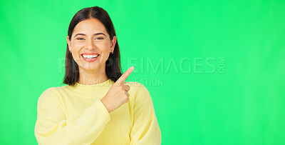 Buy stock photo Portrait, woman and pointing on green screen for advertising information, deal and promotion on studio background. Happy model show presentation of mockup, feedback and announcement of news about us