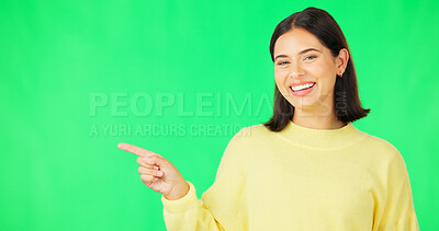 Buy stock photo Portrait, woman and pointing on green screen for presentation of information, deal and offer on studio background. Happy model advertising mockup for launch, feedback or announcement of news about us