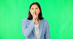 Finger, lips and face of serious woman on green screen, studio or background of privacy. Business portrait, angry female worker and silence of noise, shush or hands on mouth in secret, quiet or emoji
