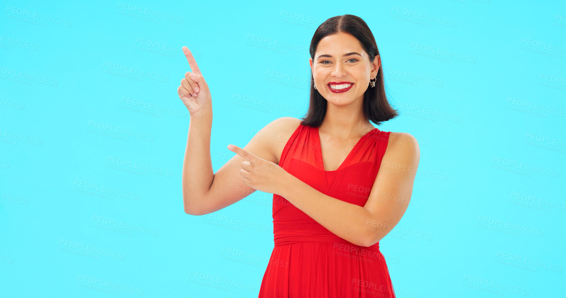 Buy stock photo Portrait, pointing or happy woman in studio for fashion product placement offer on blue background. Smile, sales deal or lady showing logo for advertising space, marketing cosmetics or brand choice