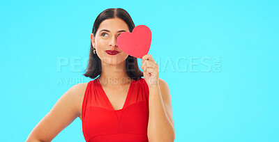 Buy stock photo Thinking, smile and woman with paper heart in studio isolated on a blue background mockup. Idea, romance and model with love sign for anniversary, emoji and smile for valentines day gift or present