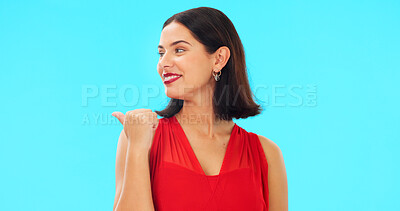 Buy stock photo Woman, point and valentines day dress in studio with thinking, suggestion or review by blue background. Girl, direction and ideas with feedback, sign and promotion with makeup, announcement or smile