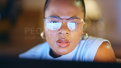 Thinking, night and face of black woman on computer working on online project, report and research in office. Corporate office, ideas and business female with focus, concentration and reading screen