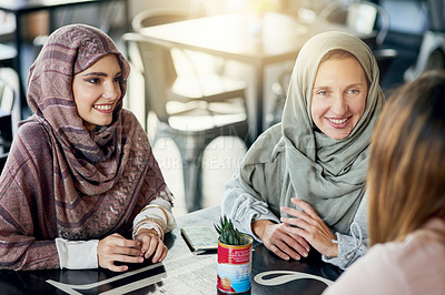 Buy stock photo Happy, friends and Muslim women in coffee shop, bonding and talking together. Cafe, relax and Islamic girls, group or people chatting, conversation and discussion for social meeting in restaurant.