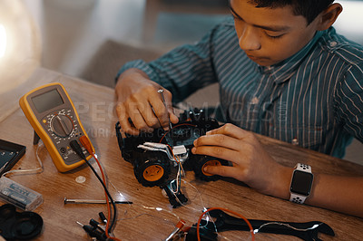 Buy stock photo Education, car robot and top view of child with homework, homeschool and science, learning and tech project. Robotics, building and boy kid with electrical knowledge, engineering or studying in house