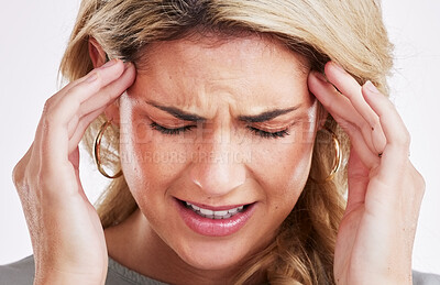 Buy stock photo Burnout, stress and woman with a headache, emergency and exhausted with pain, overworked or depression. Female person, face or model with a migraine, fatigue or frustrated against a studio background