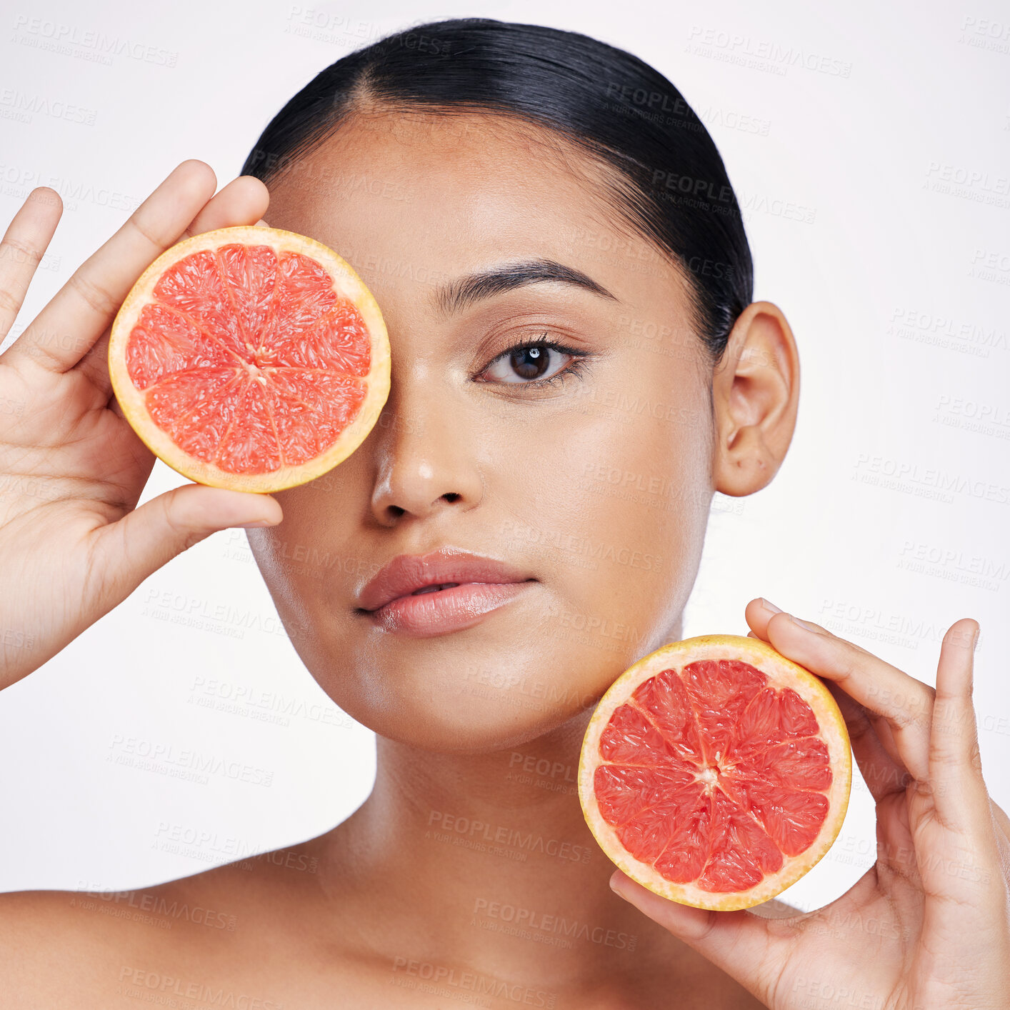 Buy stock photo Woman, portrait and grapefruit for natural skincare, beauty or cosmetics against a white studio background. Face of female person holding fruit for healthy nutrition, vitamin C or healthcare wellness