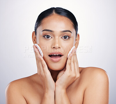 Buy stock photo Beauty, face and clean cotton on skin of woman in studio for natural dermatology and cosmetics. Female person with a skincare wipe in hand for health, wow review and wellness on a white background