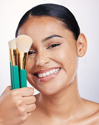 Buy stock photo Brush for makeup, face and beauty with happy woman, foundation and portrait isolated on studio background. Female model smile, natural cosmetics and skin glow with cosmetic tools and cosmetology