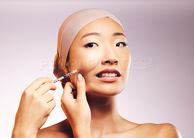 Buy stock photo Woman, bandage and plastic surgery with injection on face in studio background for asian beauty. Model, skincare filler and collagen with cosmetic treatment, syringe and cheek for facial facelift.