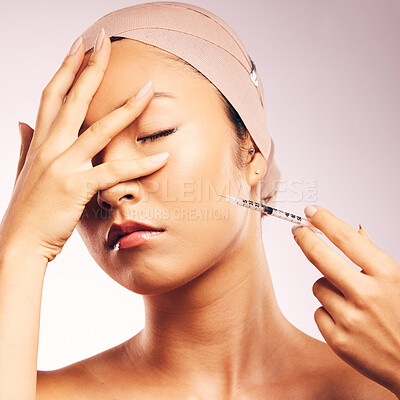 Buy stock photo Woman, plastic surgery and syringe in studio background with bandage for skincare of asian model. Female person, injection and touch face with collagen, cosmetic treatment and beauty of wellness.
