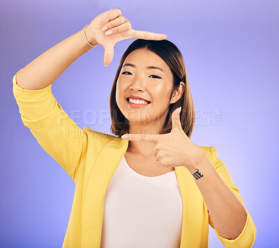 Buy stock photo Portrait, frame and Asian woman with a smile, fashion and emoji against a studio background. Face, female person and model with hand gesture, beauty and creative with happiness and finger framing