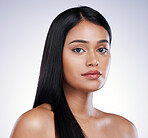 Hair care, beauty and portrait of serious woman with long hairstyle and luxury salon treatment on white background. Beauty, straight haircut and face of latino model from Brazil on studio backdrop.