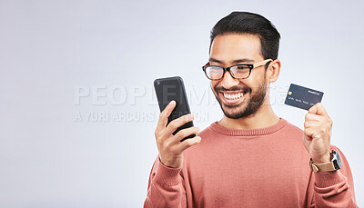 Buy stock photo Happy man, smartphone and credit card for online shopping, discount or promo isolated on studio background. Positive customer experience, ecommerce and fintech, male person and sale with mockup space