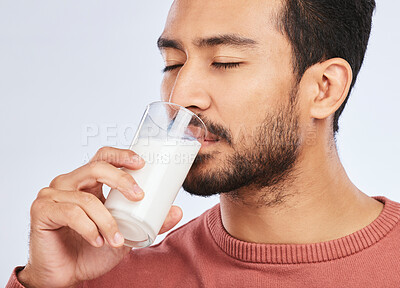 Buy stock photo Man drinking milk, health and nutrition with calcium, vitamins and wellness isolated on white background. Dairy product in glass, beverage and male person with healthy diet for strong bones in studio