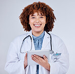 Tablet, doctor portrait and woman isolated on a white background of happy healthcare research or telehealth services. Face of african medical person typing on digital tech and paperless app in studio