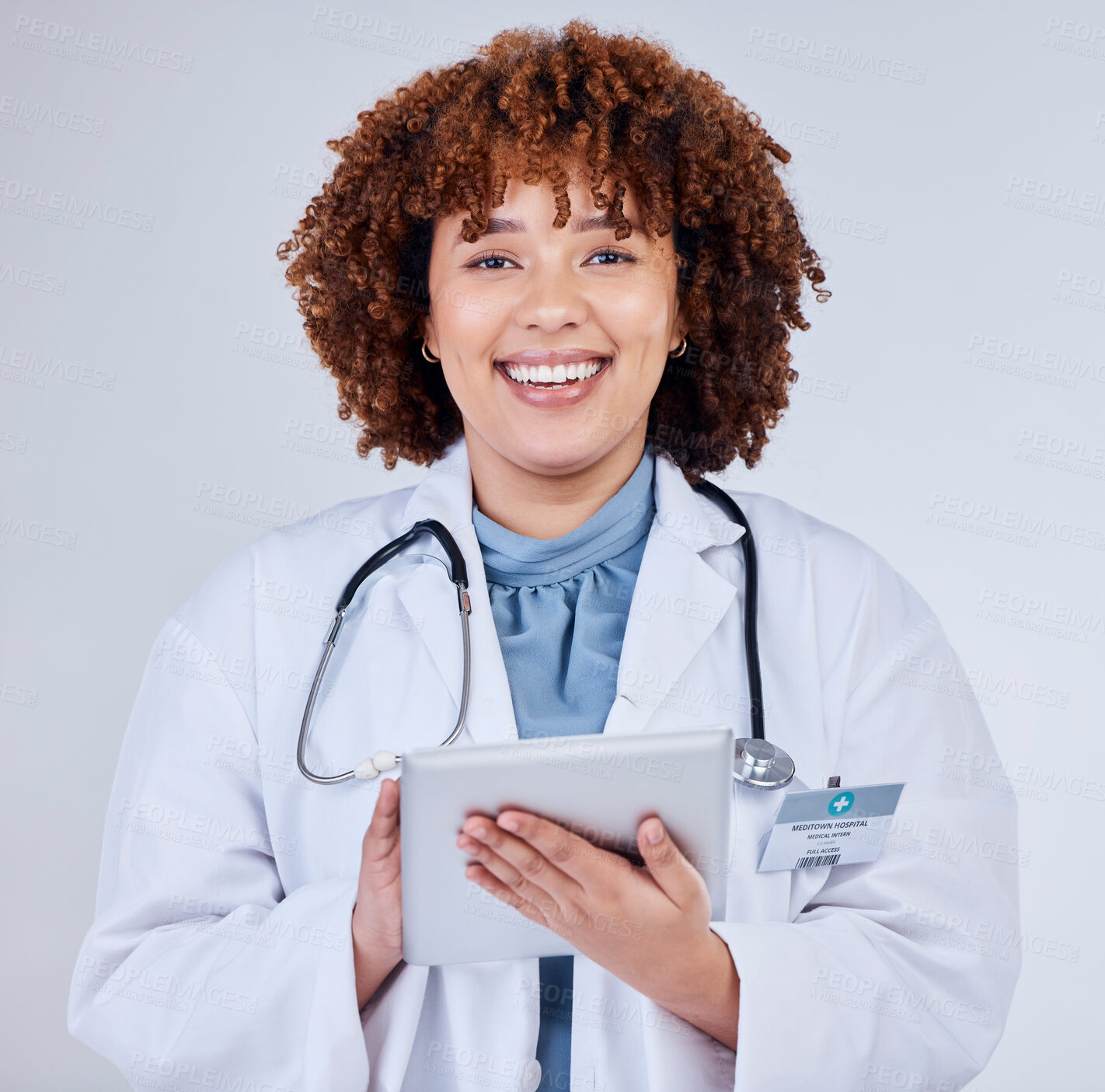 Buy stock photo Tablet, doctor portrait and woman isolated on a white background of happy healthcare research or telehealth services. Face of african medical person typing on digital tech and paperless app in studio