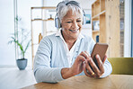 Senior woman, phone and music headphones with a smile while listening to audio, radio or podcast. Elderly female person in a house with a smartphone for streaming online, mobile app and relax 