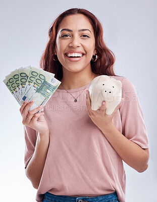 Buy stock photo Money, portrait or happy girl with a piggy bank for financial wealth or savings on white background. Finance, investment or woman smiling or investing Euros or budget in tin for safety or security