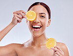 Skincare, portrait or happy woman with orange or natural facial with citrus or vitamin c for wellness. Studio background, smile or healthy girl smiling with organic fruits for dermatology beauty 