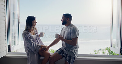 Buy stock photo Couple, coffee and window on holiday by sea with conversation, romance and love in summer sunshine. Woman, man and drink with latte, morning or matcha on vacation with ocean view in home with bond